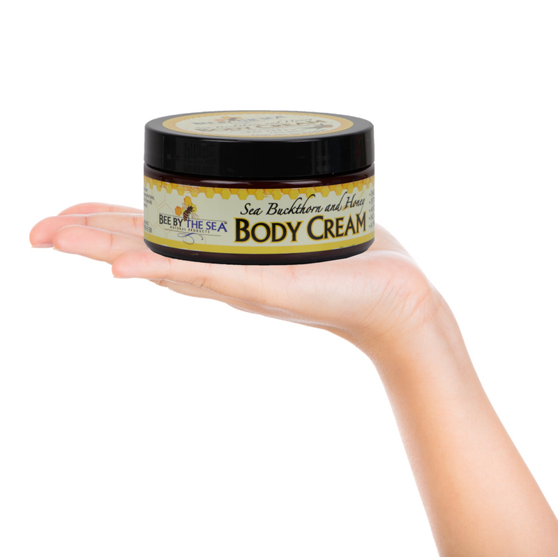 Bee By The Sea Buckthorn and Honey Body Cream on the hand